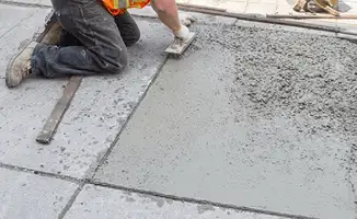 Professional repairing a concrete floor in Sioux Falls, SD